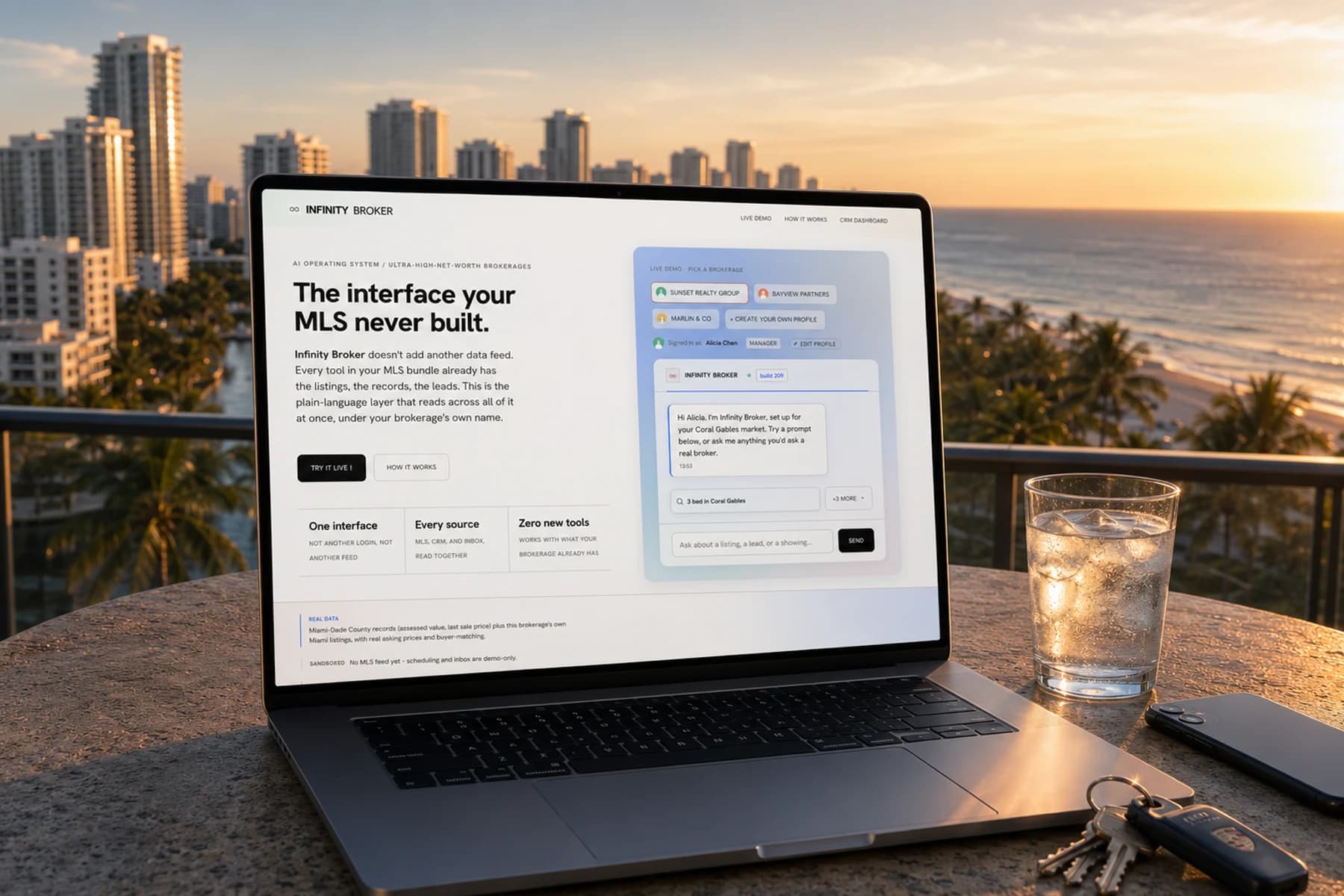 Infinity Broker (since renamed Footing) open on a laptop on a Miami terrace at golden hour, the Atlantic and a coastline of pale towers behind it, palms catching the last light, a glass of iced water and car keys on the table. The screen shows the headline 'The interface your MLS never built.', the One interface / Every source / Zero new tools strip, and the pastel-gradient live demo panel with brokerage chips and a chat greeting.
