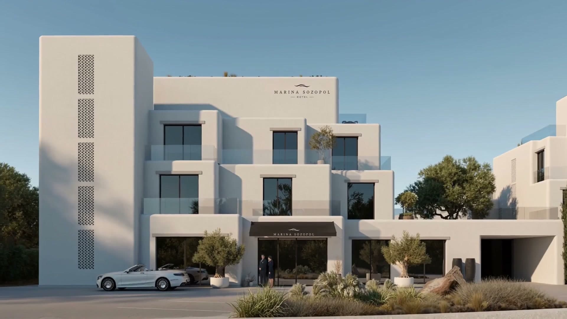 The finished residences from the street: stepped white facades, glass balconies and a car at the entrance.