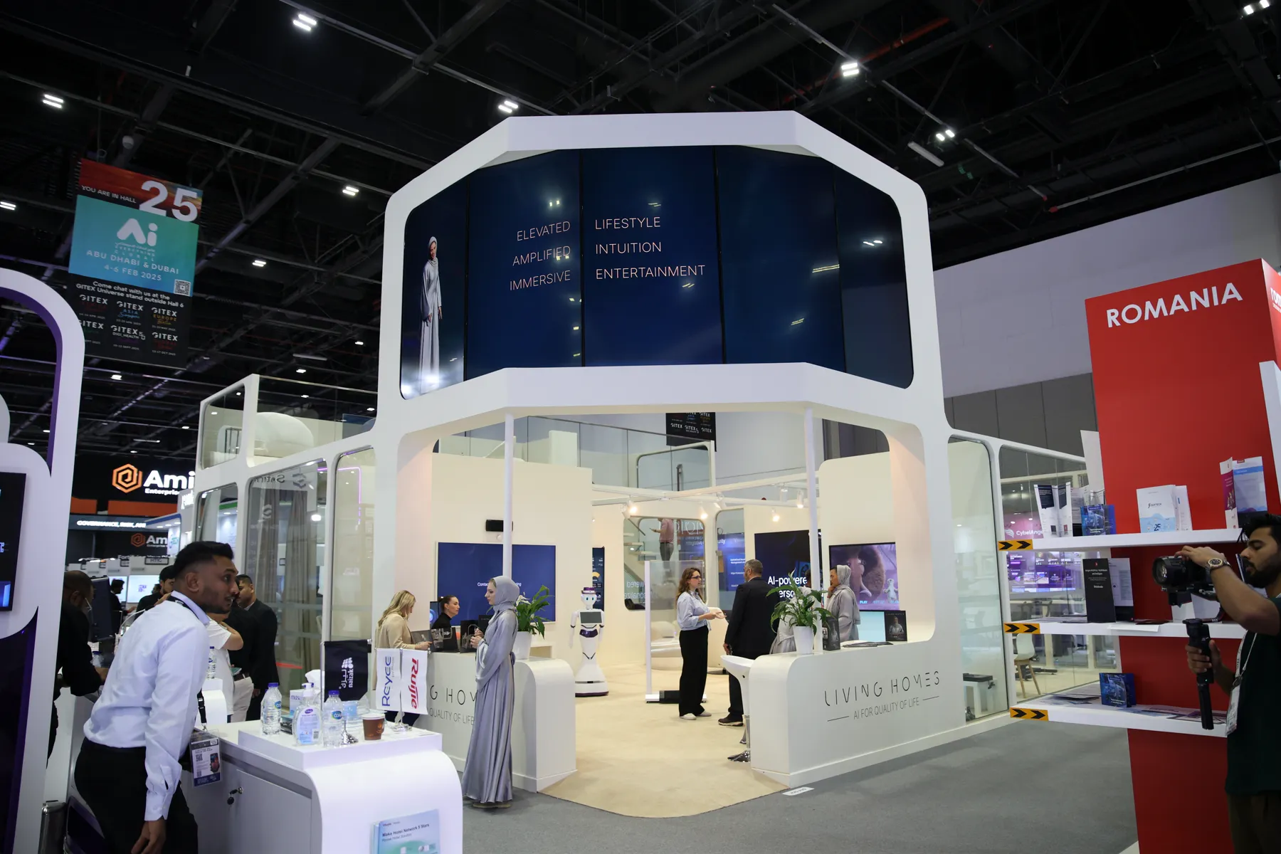 The Living Homes exhibition stand on the show floor at GITEX Global 2024, with wall displays and seating.